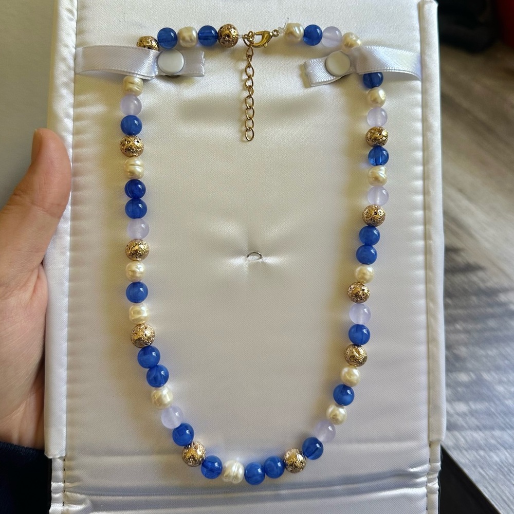 Handmade blue and gold beaded necklace.